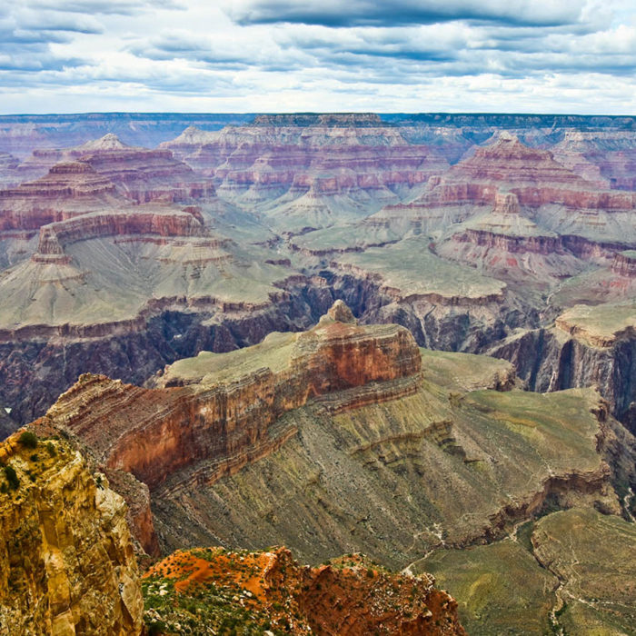 Taken this picture of the Grand Canyon South Rim. It was overcast and raining at a distant and sunny over the canyon. The Colorado river is visible at a distant.